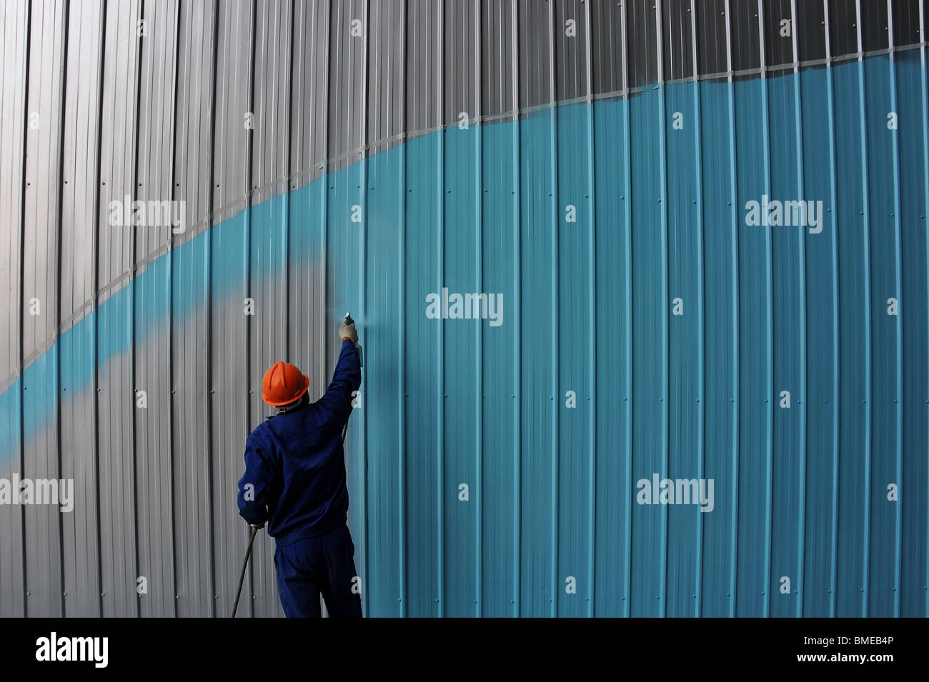 Construction worker spray paint exhibition hall in blue, 2010 Shanghai
