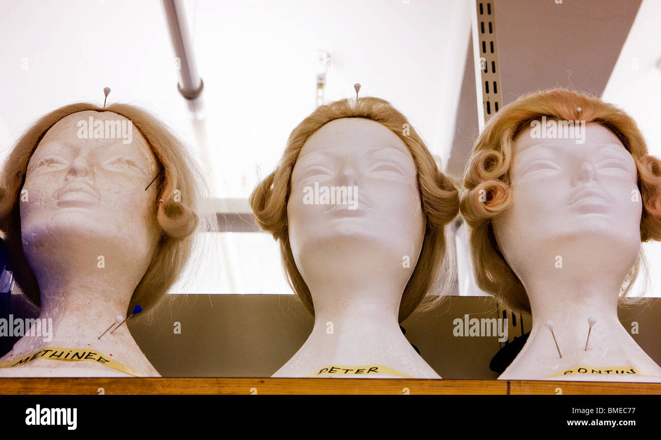 Wigs displayed on mannequin Stock Photo