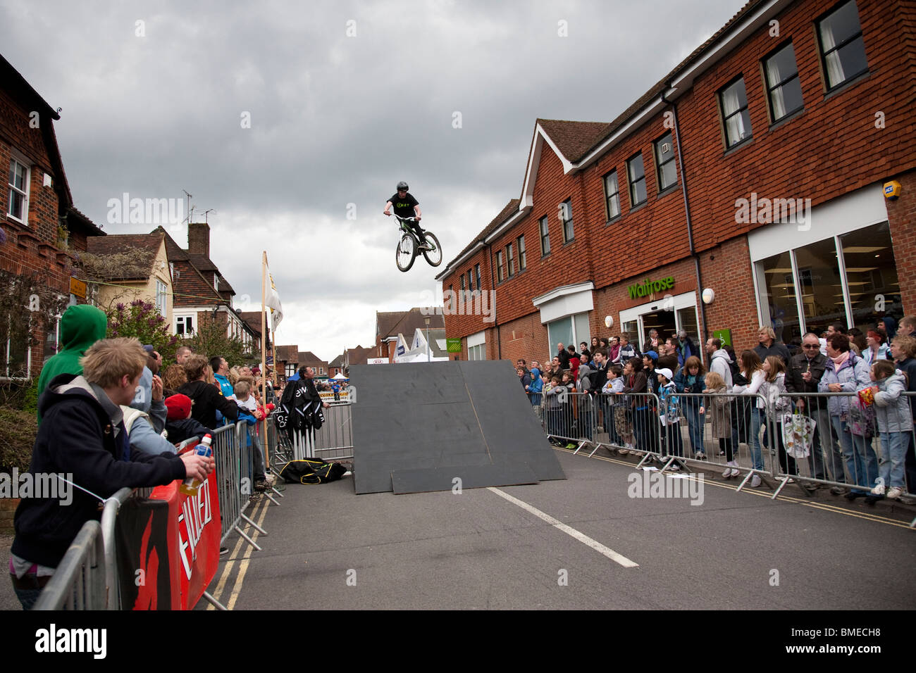 A BMX rider gains maximum height during an acrobatics display