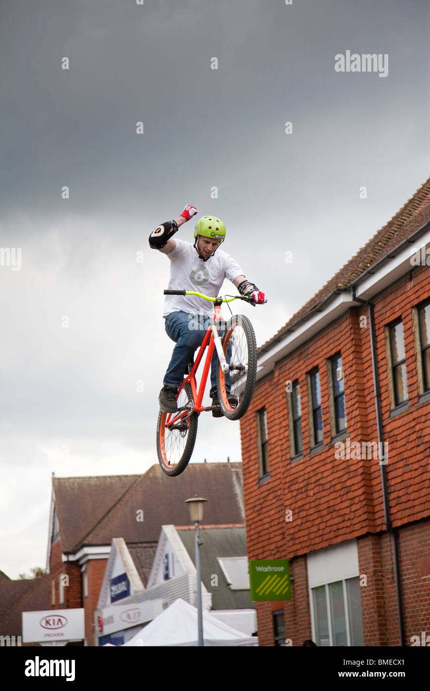 A BMX rider gains maximum height during an acrobatics display