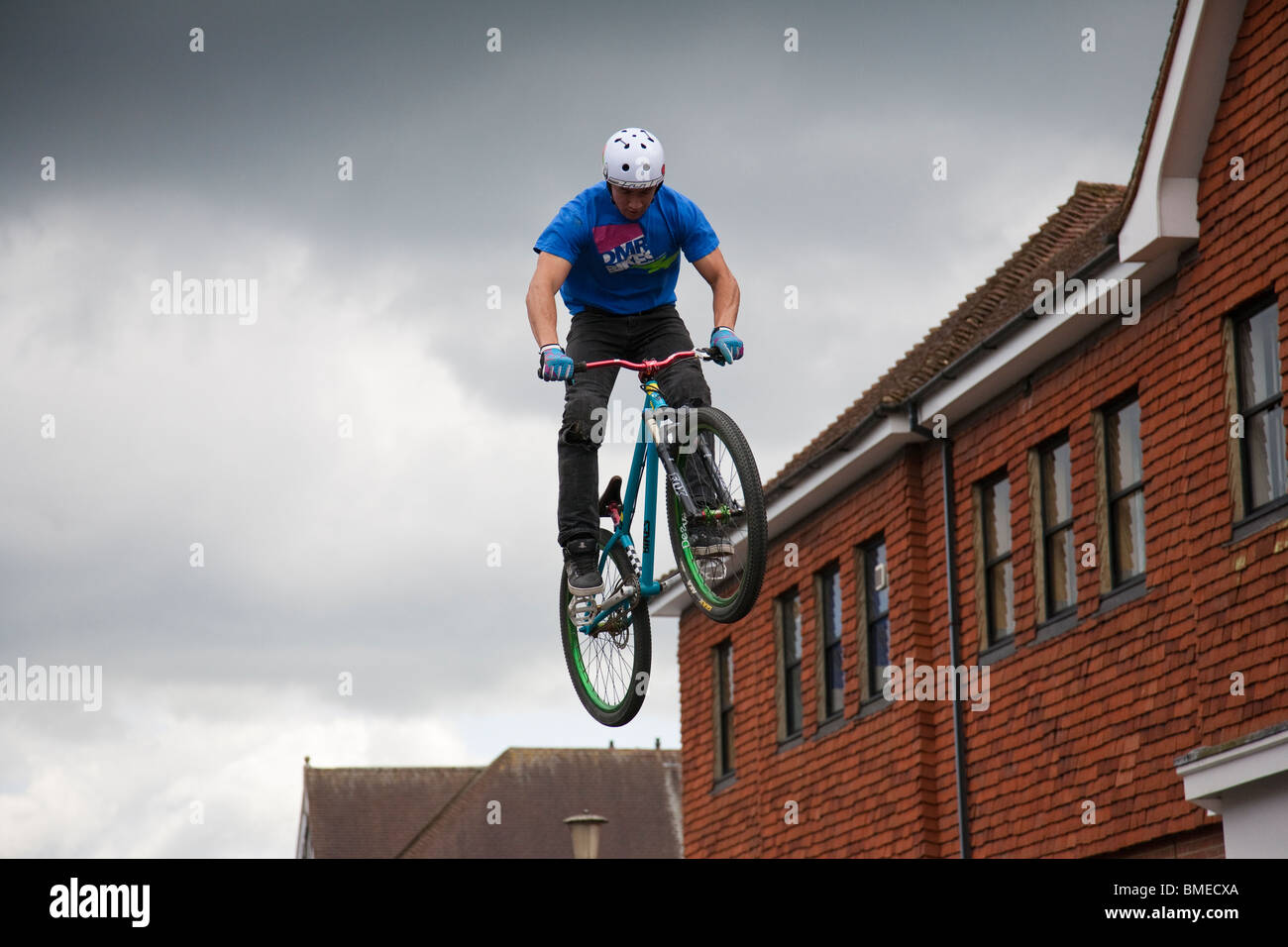 A BMX rider gains maximum height during an acrobatics display
