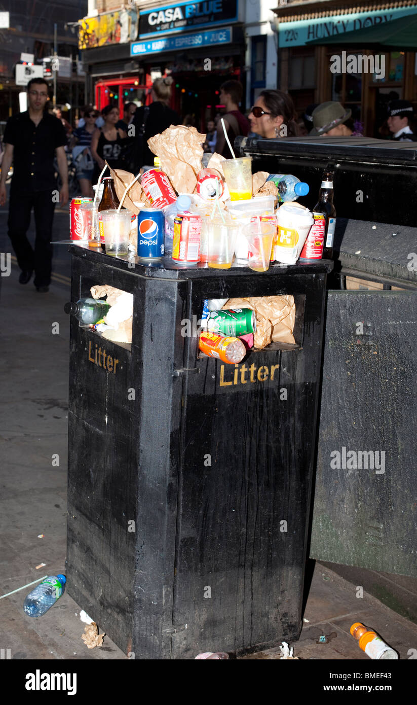 Overflowing bin, Brick Lane, London England Stock Photo