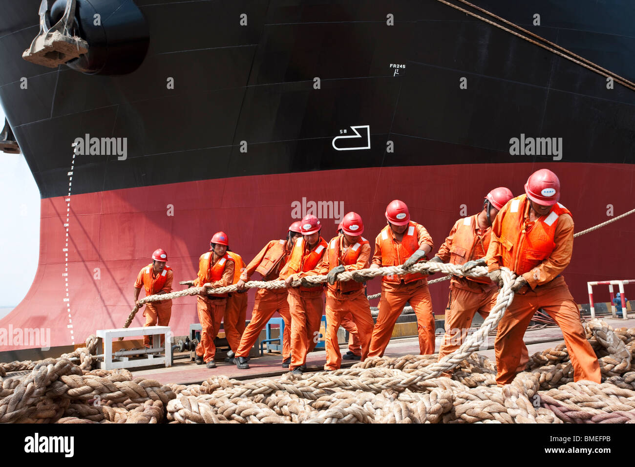 Men pulling ropes, Shanghai Waigaoqiao Shipbuilding Company, Shanghai ...