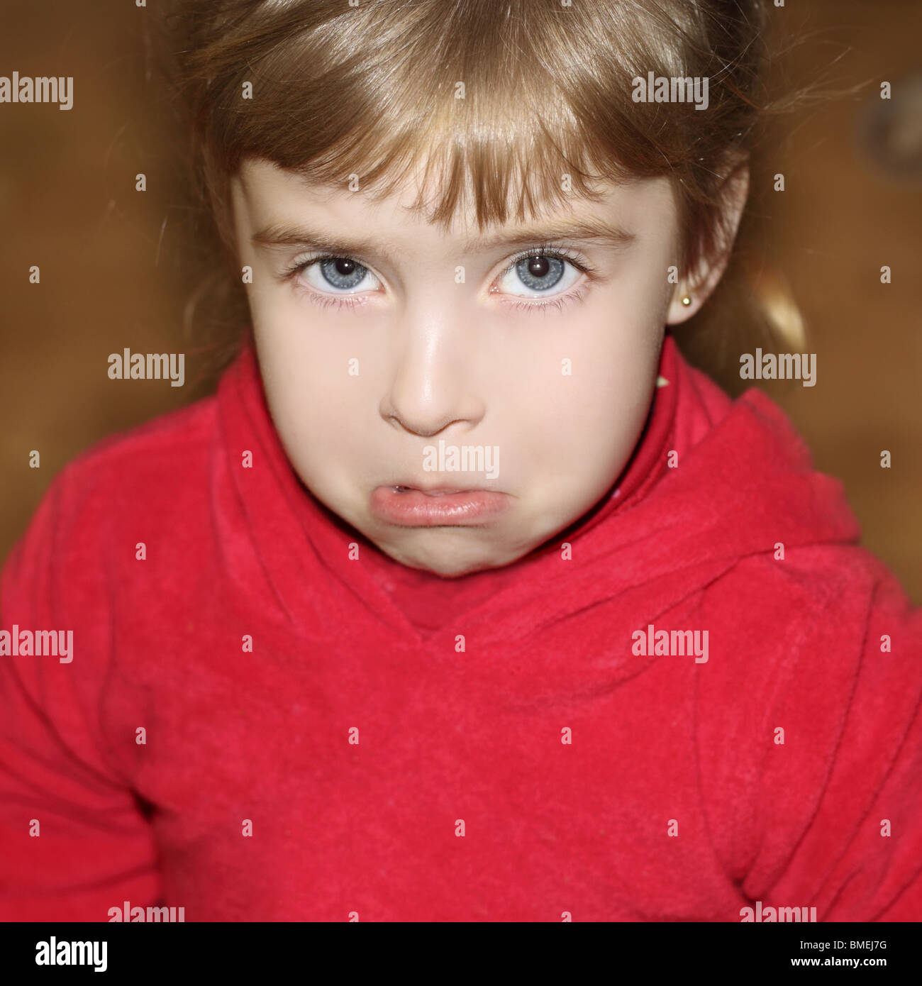 crying weeping gesture face little blond girl face portrait Stock Photo