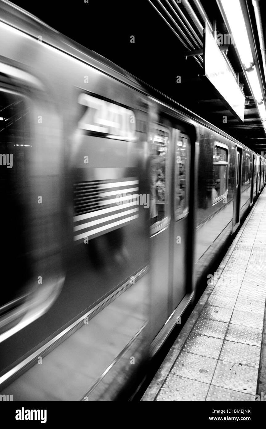 American flag blurs as it passes by on a subway car in New York City, NY, USA. Stock Photo