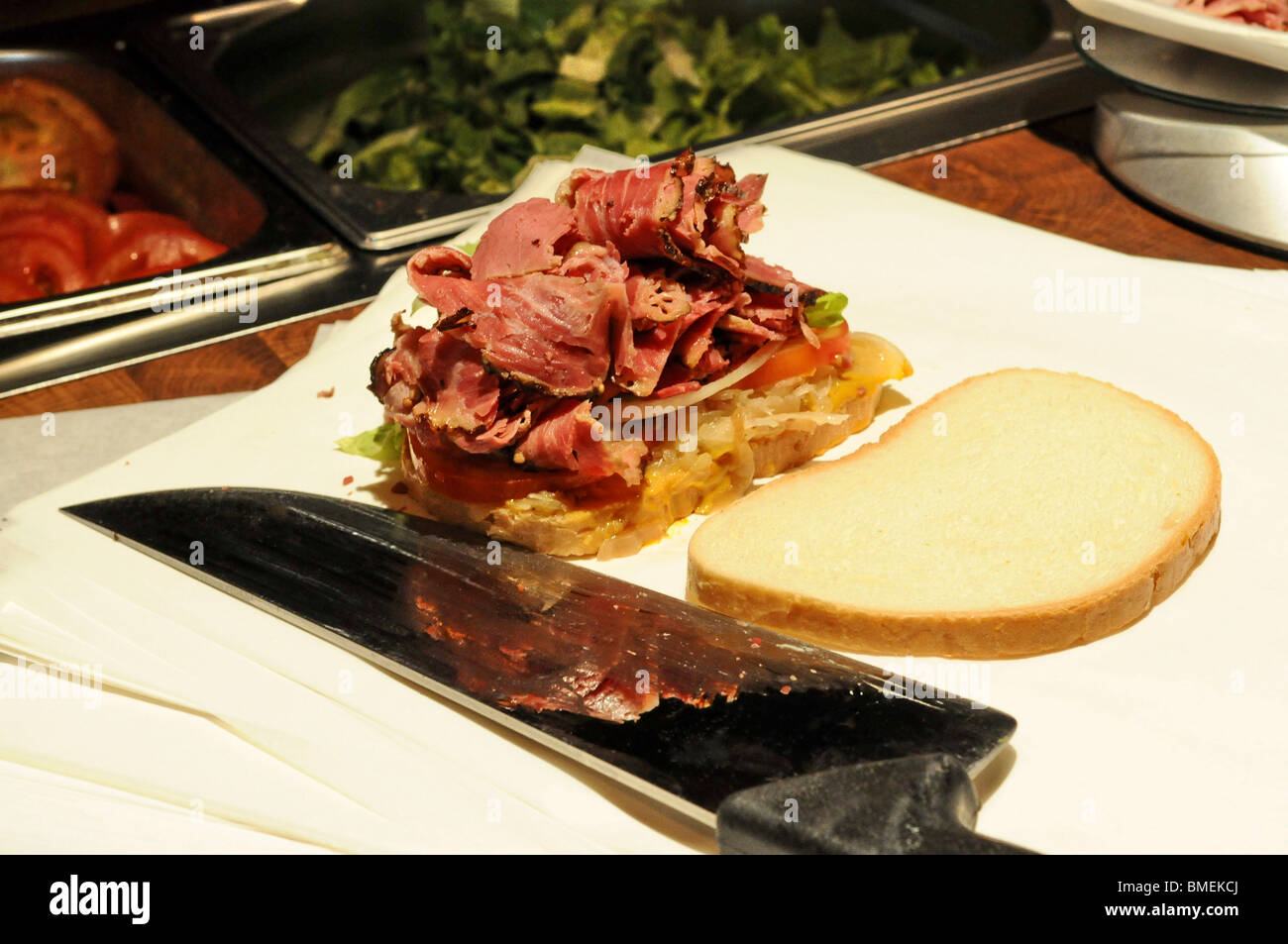 preparing a Kosher New York delistyle corned beef sandwich a weighed