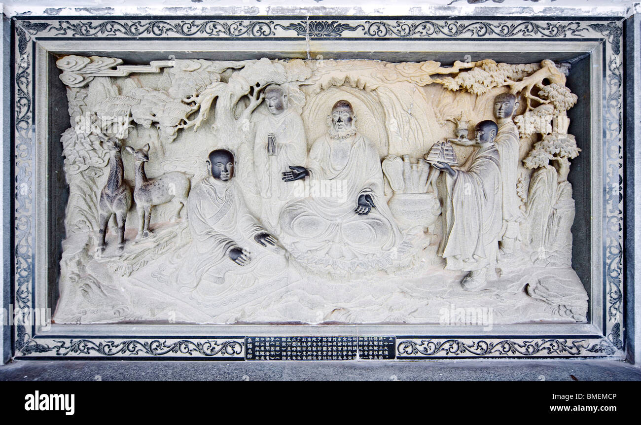 Memorial tablet carved with story of Xuanzang propagate Buddhism, Guanyin Hall, Putuo Mount, Zhoushan City, Zhejiang, China Stock Photo