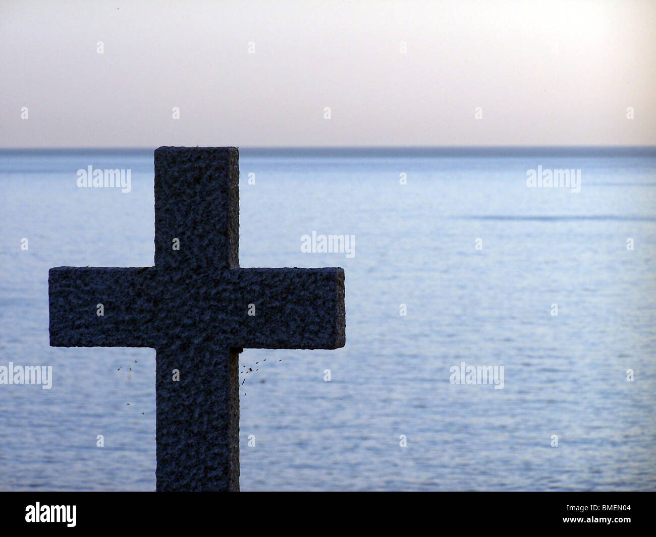 Celtic cross on a coastal path in Cornwall. Stock Photo