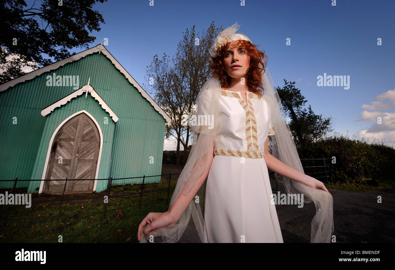 A model poses in a wedding dress created by designer Lisa Redman. Stock Photo