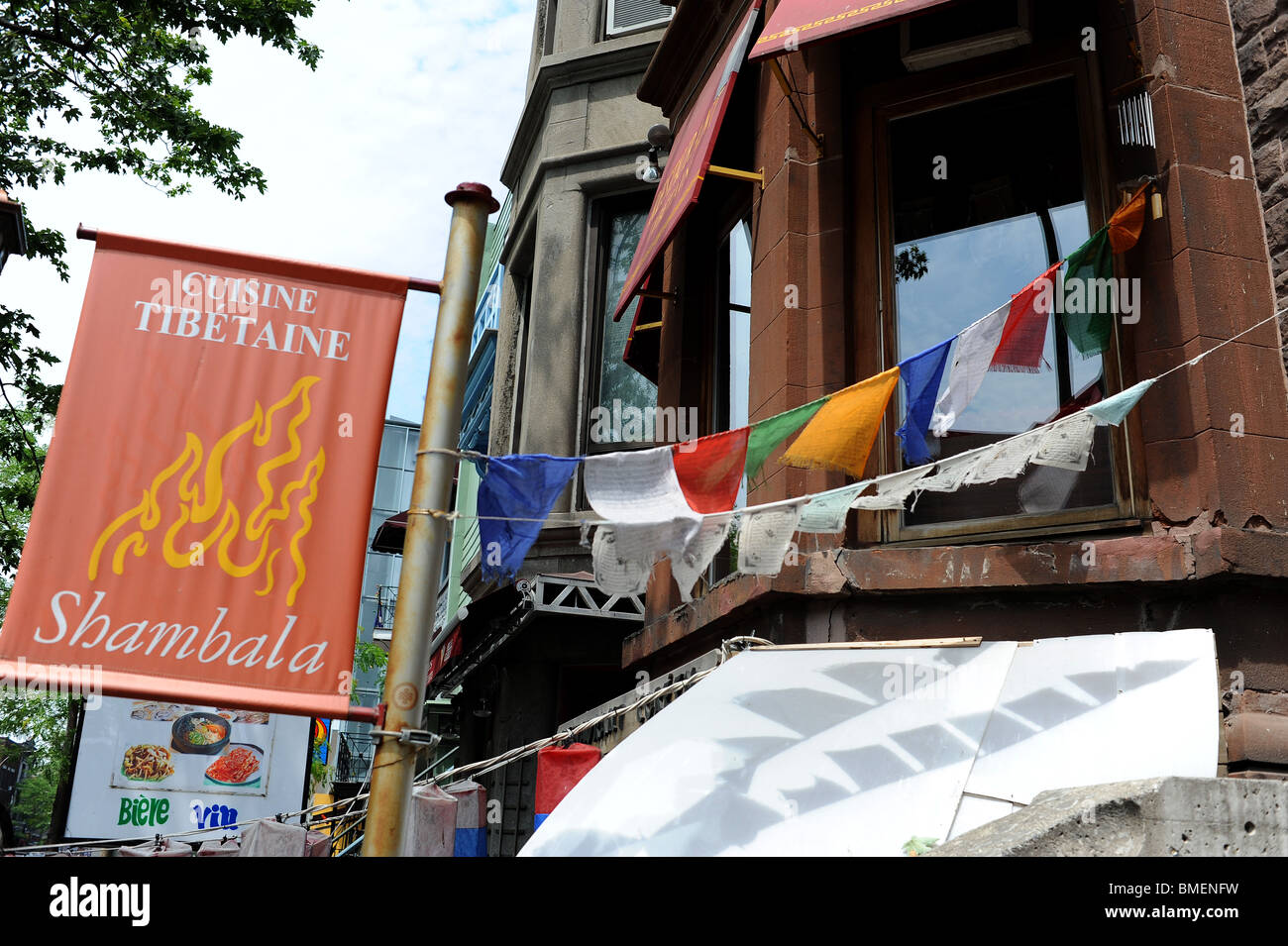 Cuisine Tibetan sign and flags outside Tibetan restaurant in Montreal