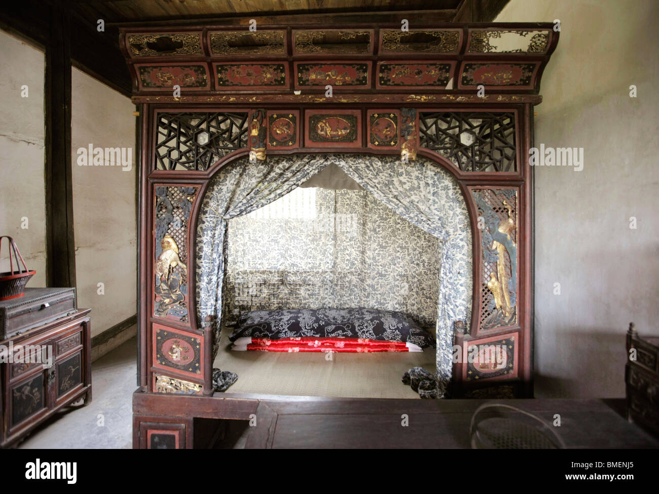 Traditional wooden bed carved with exquisite patterns, Lu's Residence