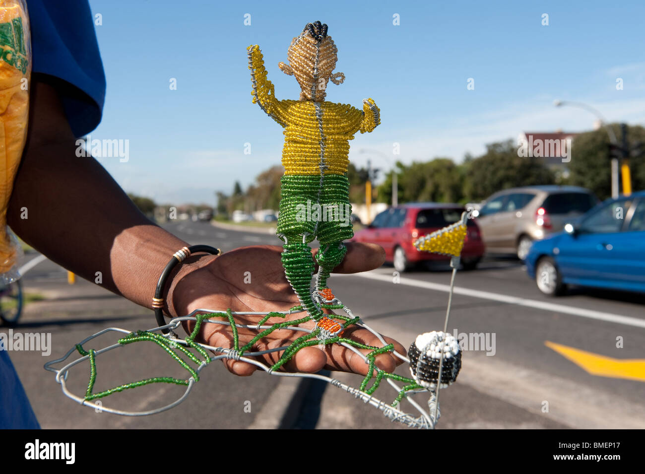 Street vendor sells a handcrafted football player statue made from wire and glass beads, Cape Town, South Africa Stock Photo