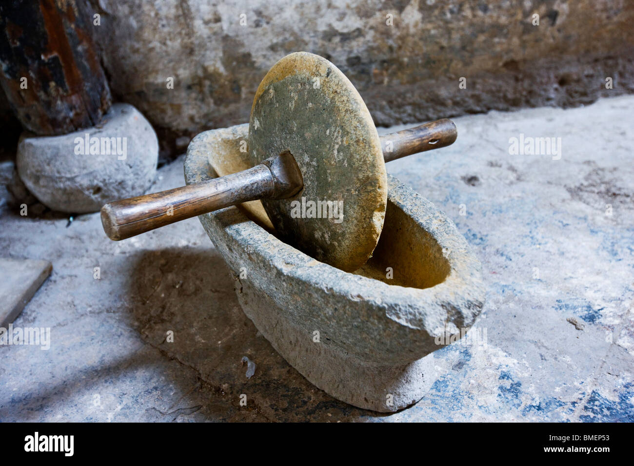 Stone grinder for processing herbs in a Chinese herbal medicine store, Zhuge Bagua Village, Jinhua, Zhejiang Province, China Stock Photo