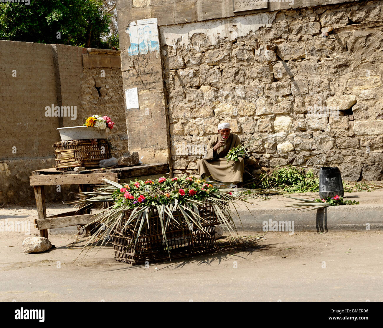 old man selling flowers , souk goma (friday market), street market, Southern Cemeteries, Khalifa district ,cairo Stock Photo