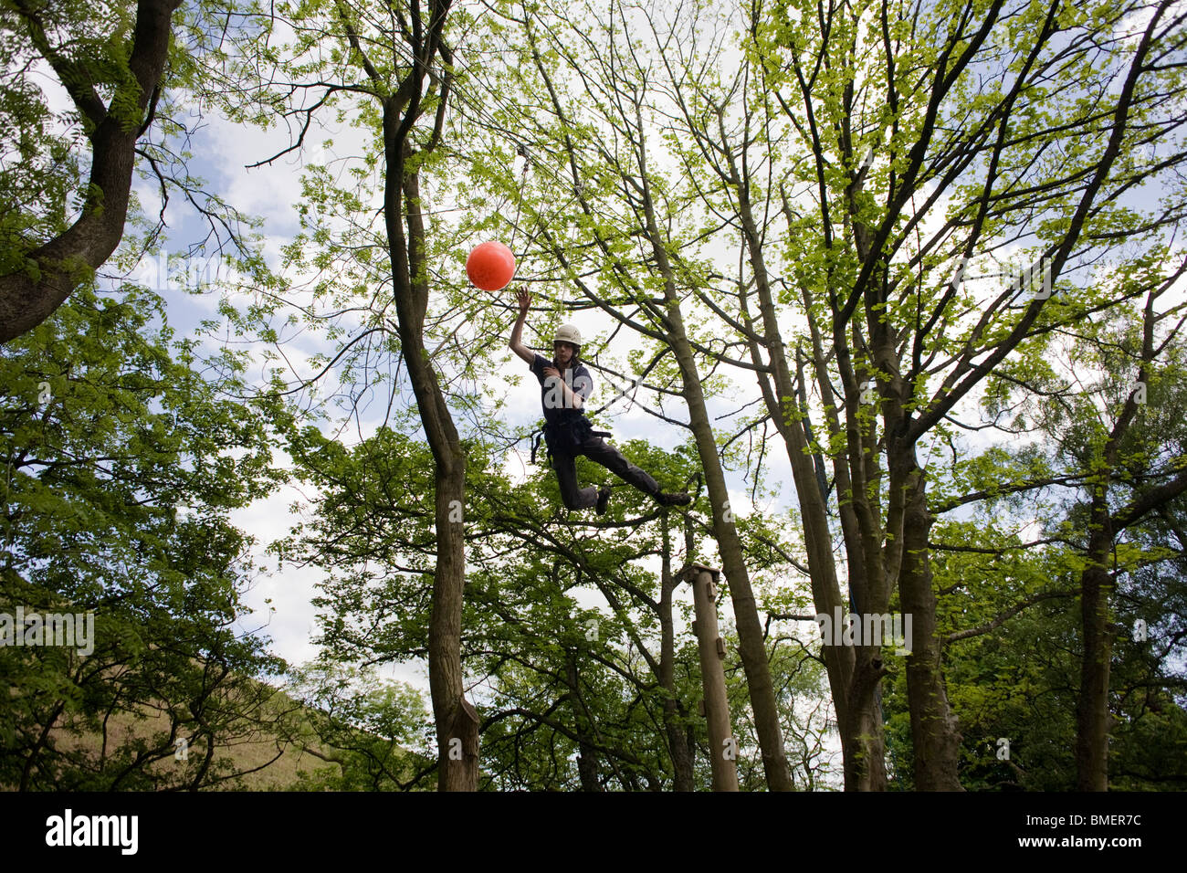 Leap of Faith from high pole activity test for young boys at YHA Edale. Stock Photo