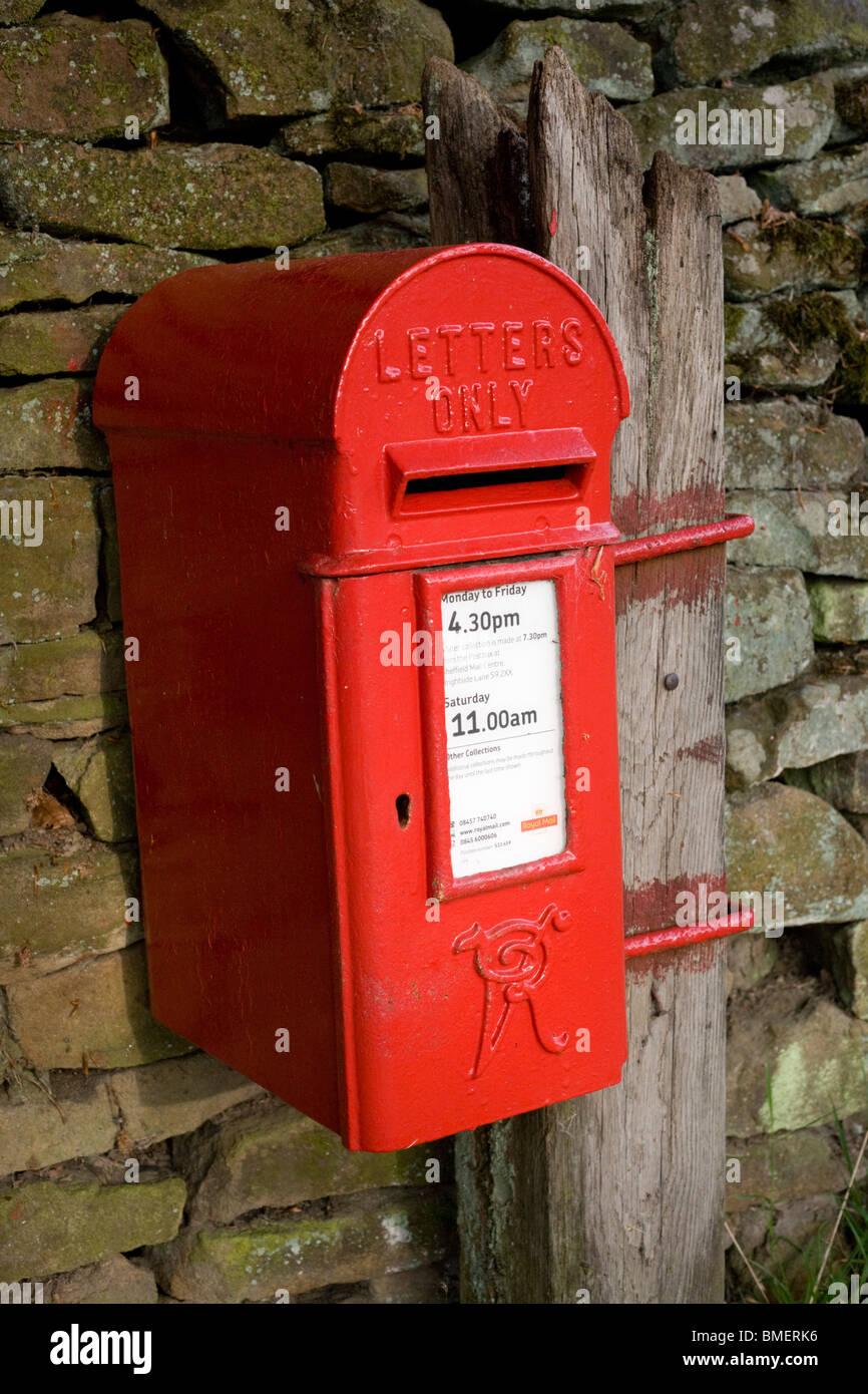 Red Victorian rural post box mounted at dry stone wall in Vale of Edale ...