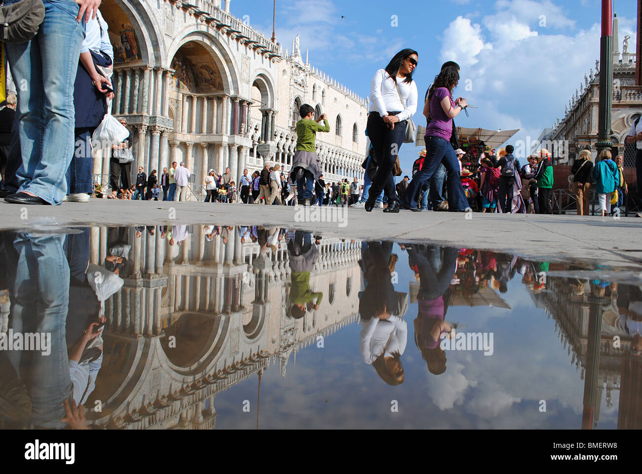 The Doge's palace reflected in a puddle in St Mark's square, Venice ...