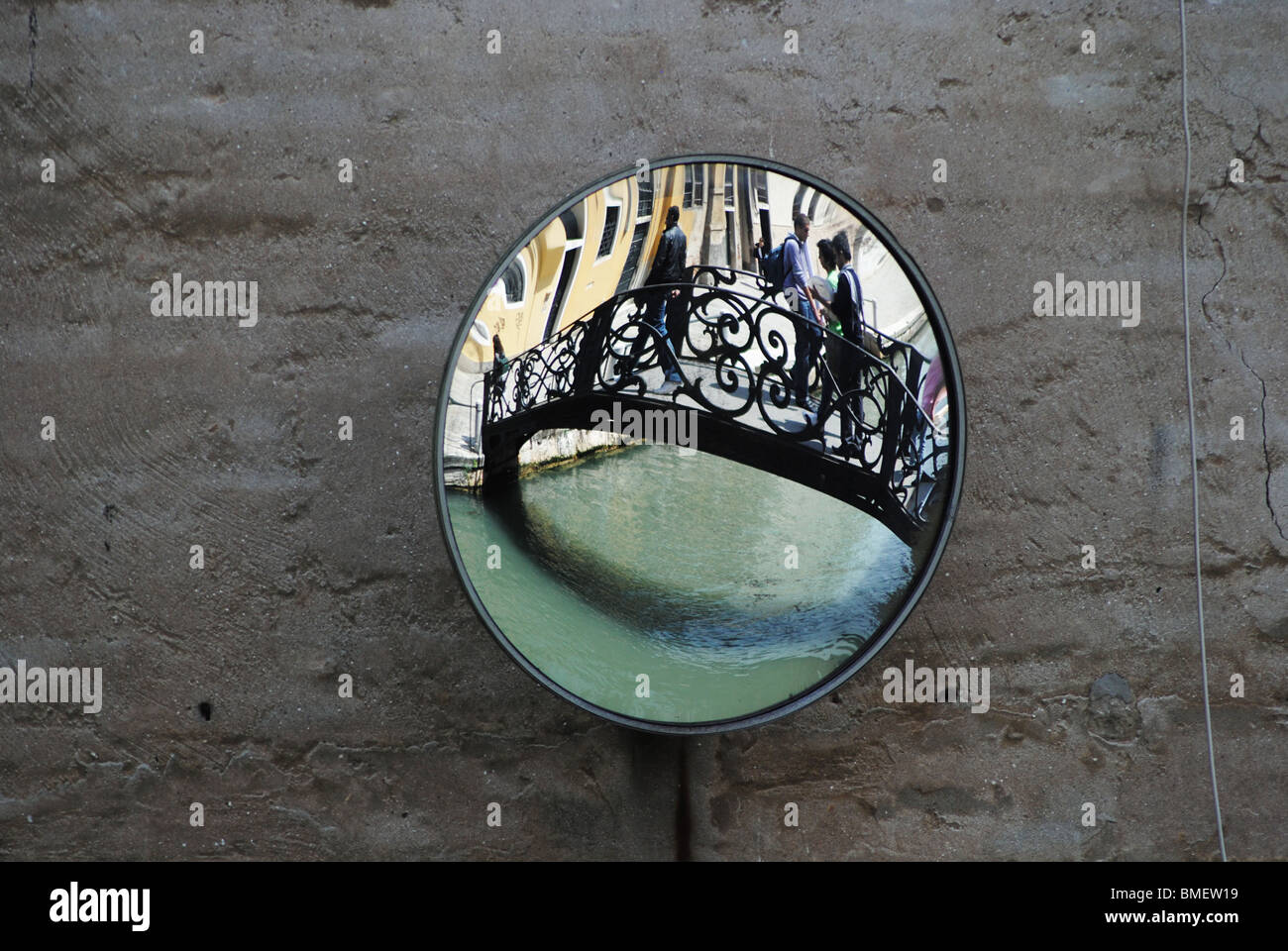 Mirror and canal at a blind spot for boat traffic, Venice, Italy Stock Photo