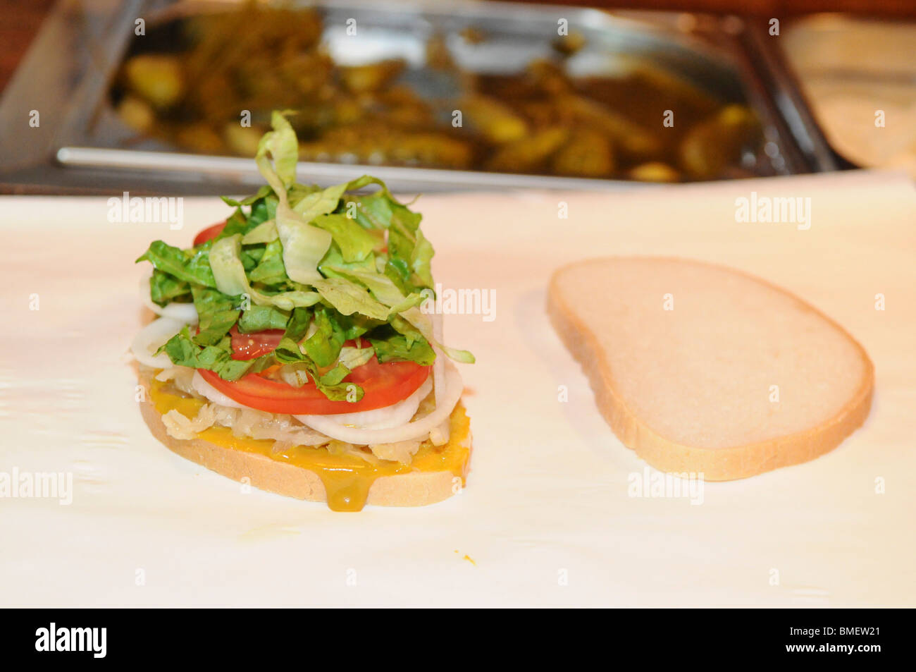 preparing a Kosher New York delistyle corned beef sandwich with