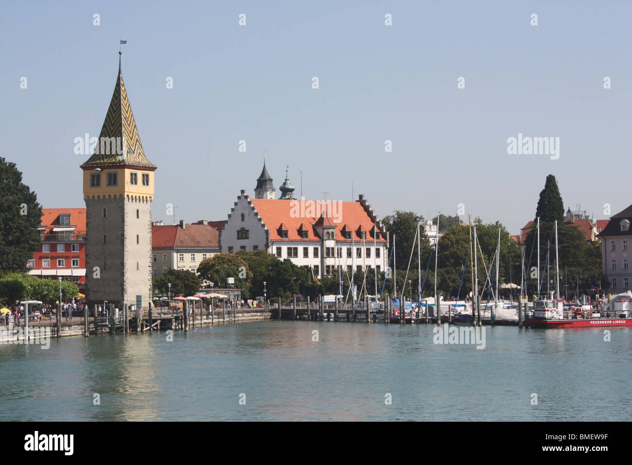 Lindau (Bodensee) Marina and The Mangturm (Mangenturm) tower on the edge of Lake Constance (Konstanz) in Germany on a sunny day Stock Photo