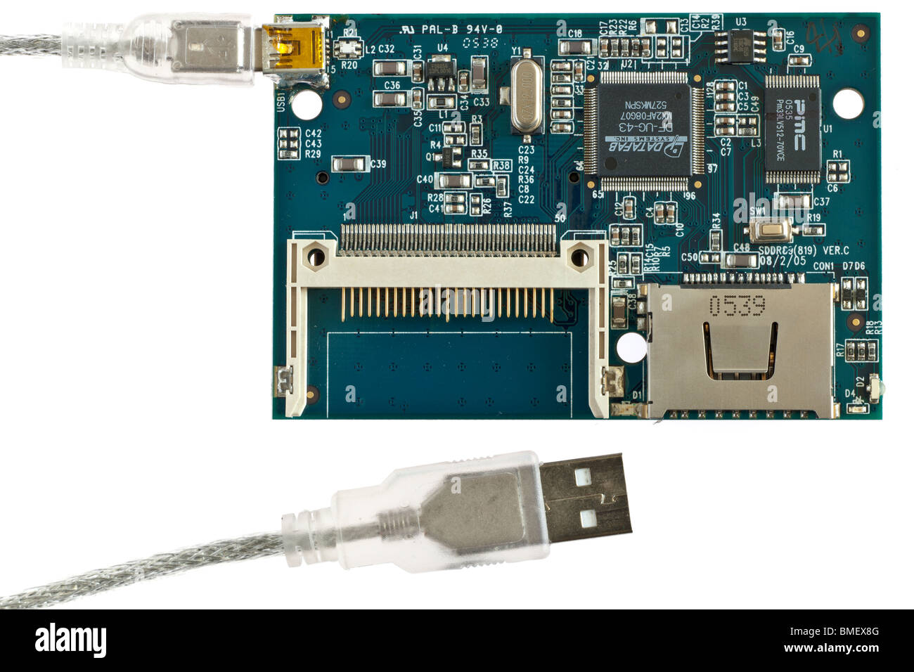 Inner pcb board workings on a multi card reader with Usb 2 to mini USB cable Stock Photo