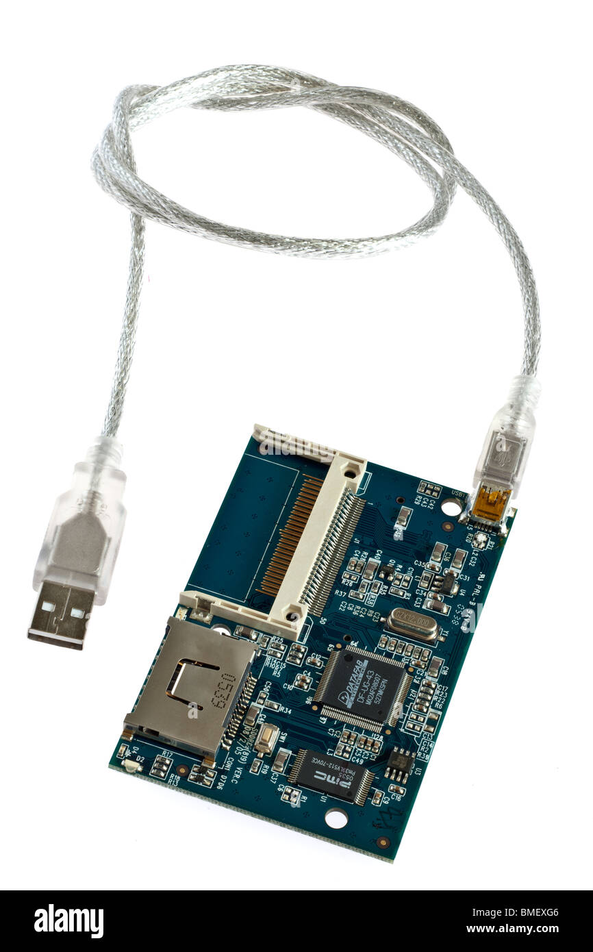 Inner pcb board workings on a multi card reader with Usb 2 to mini USB cable Stock Photo