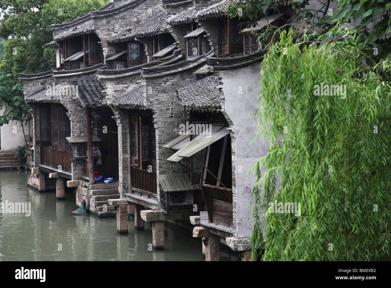 Two story traditional houses along the canal, Xizha, Wuzhen, Tongxiang City, Zhejiang Province, China Stock Photo