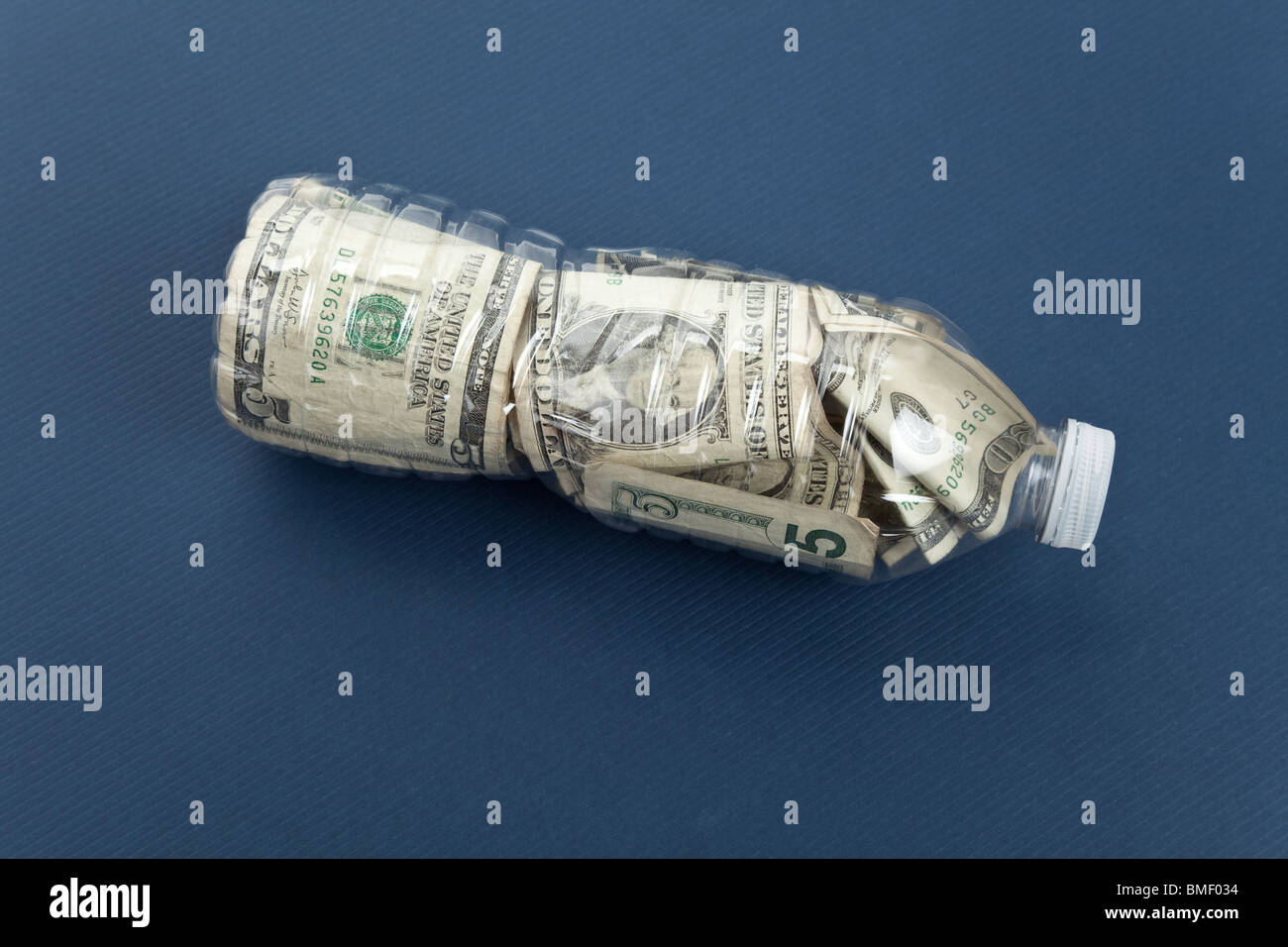 Plastic Bottle and Dollar with blue background Stock Photo Alamy
