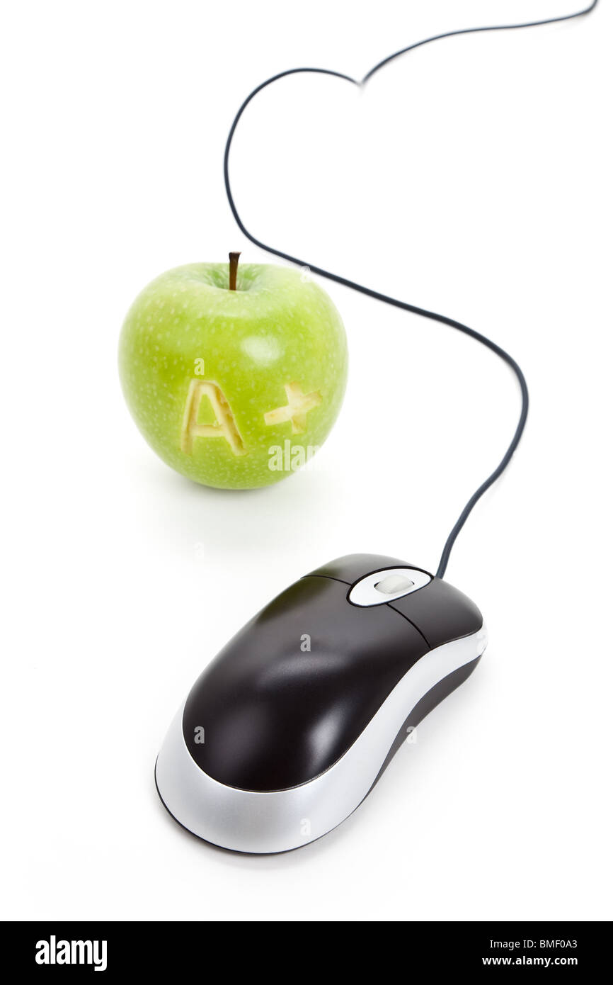 Green apple and computer mouse close up Stock Photo