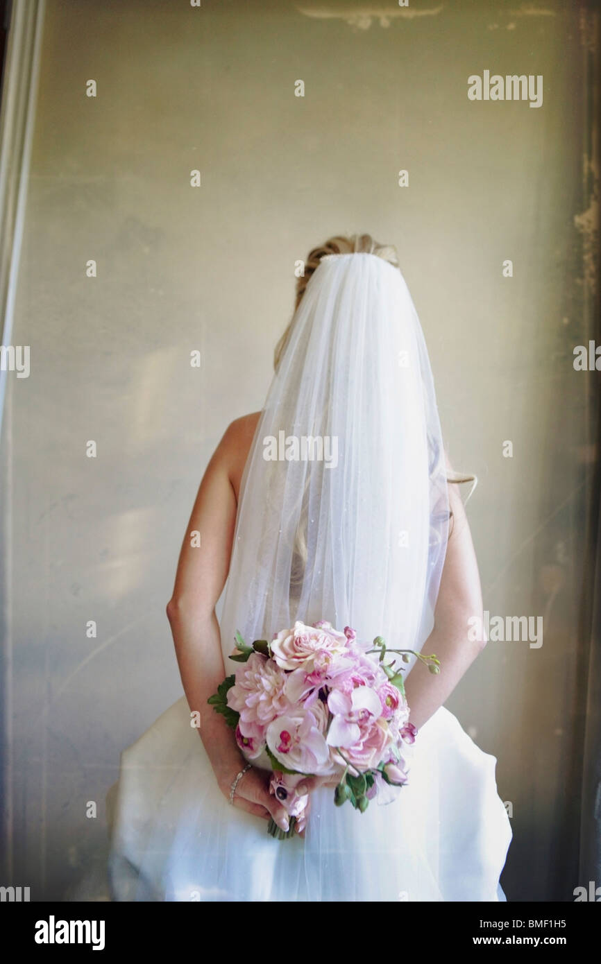 A Bride Holding Her Floral Bouquet Stock Photo