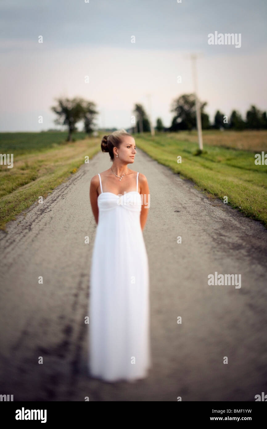 Vineland, Ontario, Canada; A Bride Standing In The Middle Of The Road Stock Photo