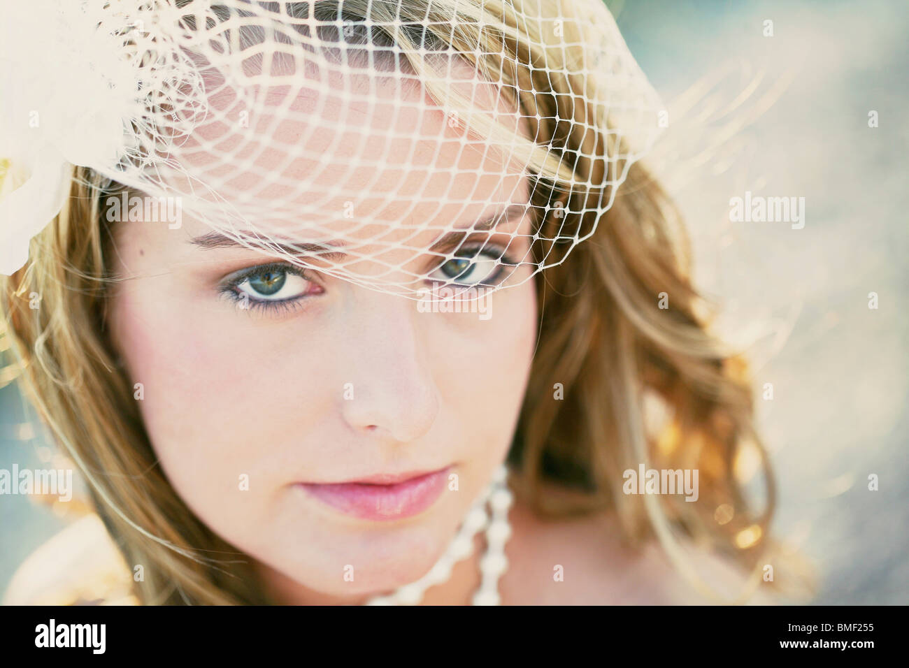 A Bride With A Veil And Pearls Stock Photo