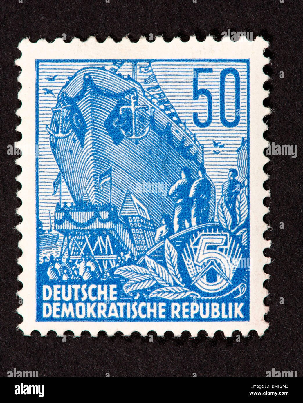Postage stamp from East Germany (German Democratic Republic) depicting a ship launching. Stock Photo
