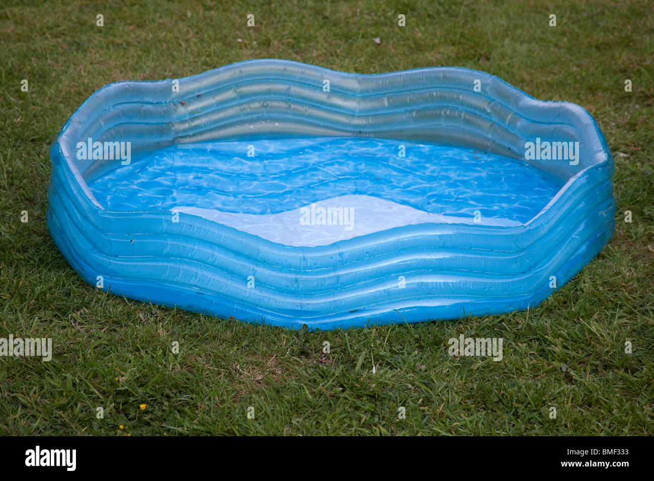 Children's paddling pool on grass, Hampshire England Stock Photo Alamy