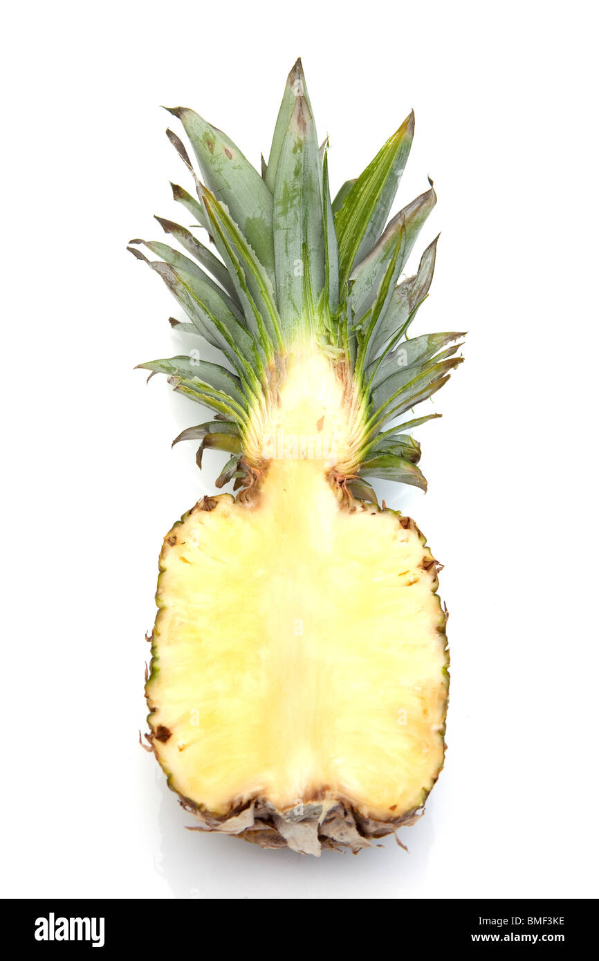 Pineapple halved isolated on a white studio background Stock Photo - Alamy