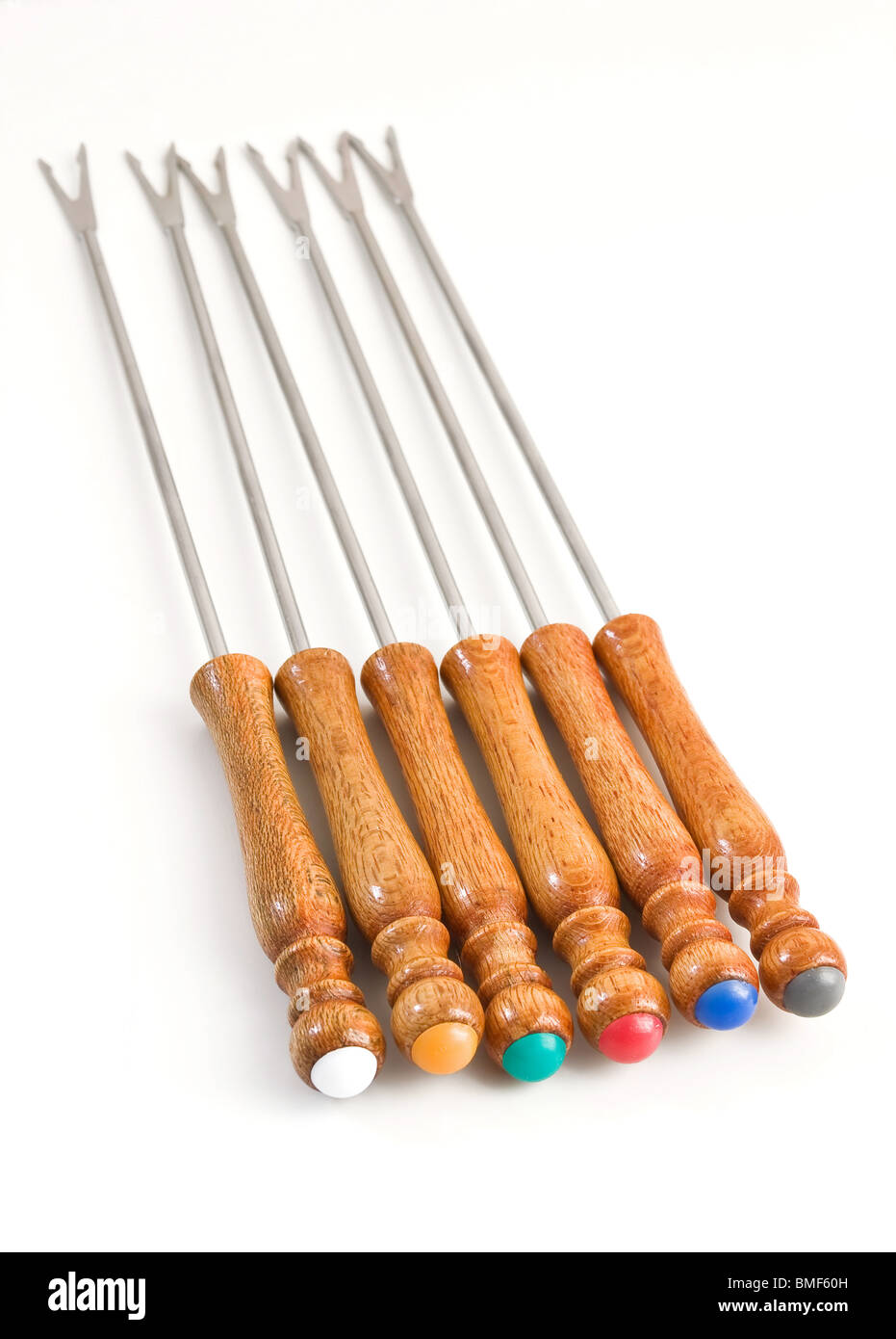 Characteristic forks used for fondue or bourguignonne Stock Photo Alamy