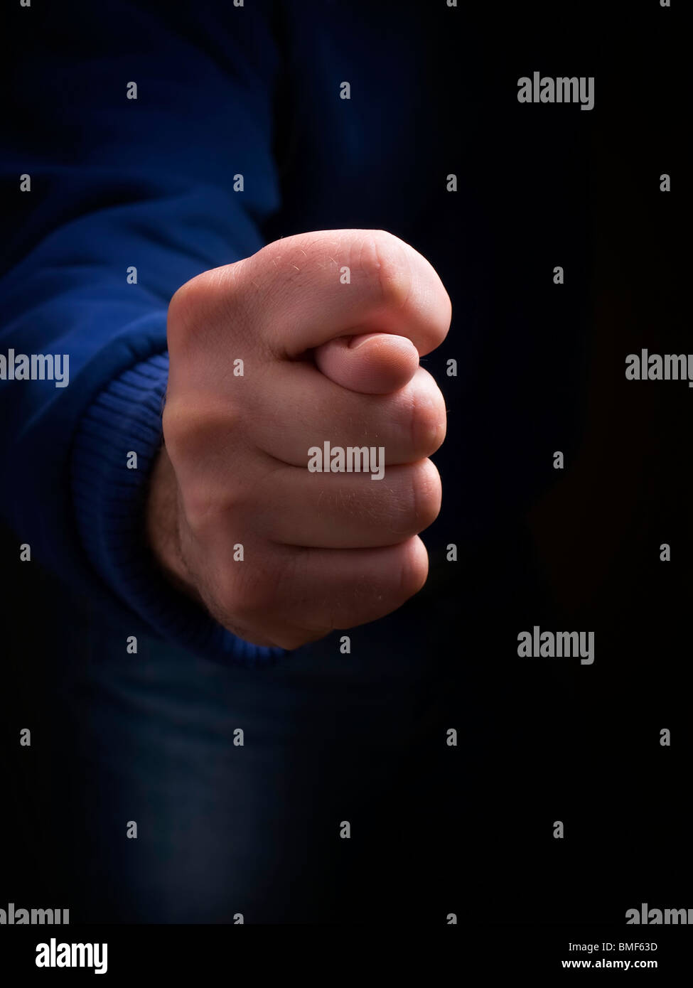 Gesture as cross fingers on a dark background. Stock Photo