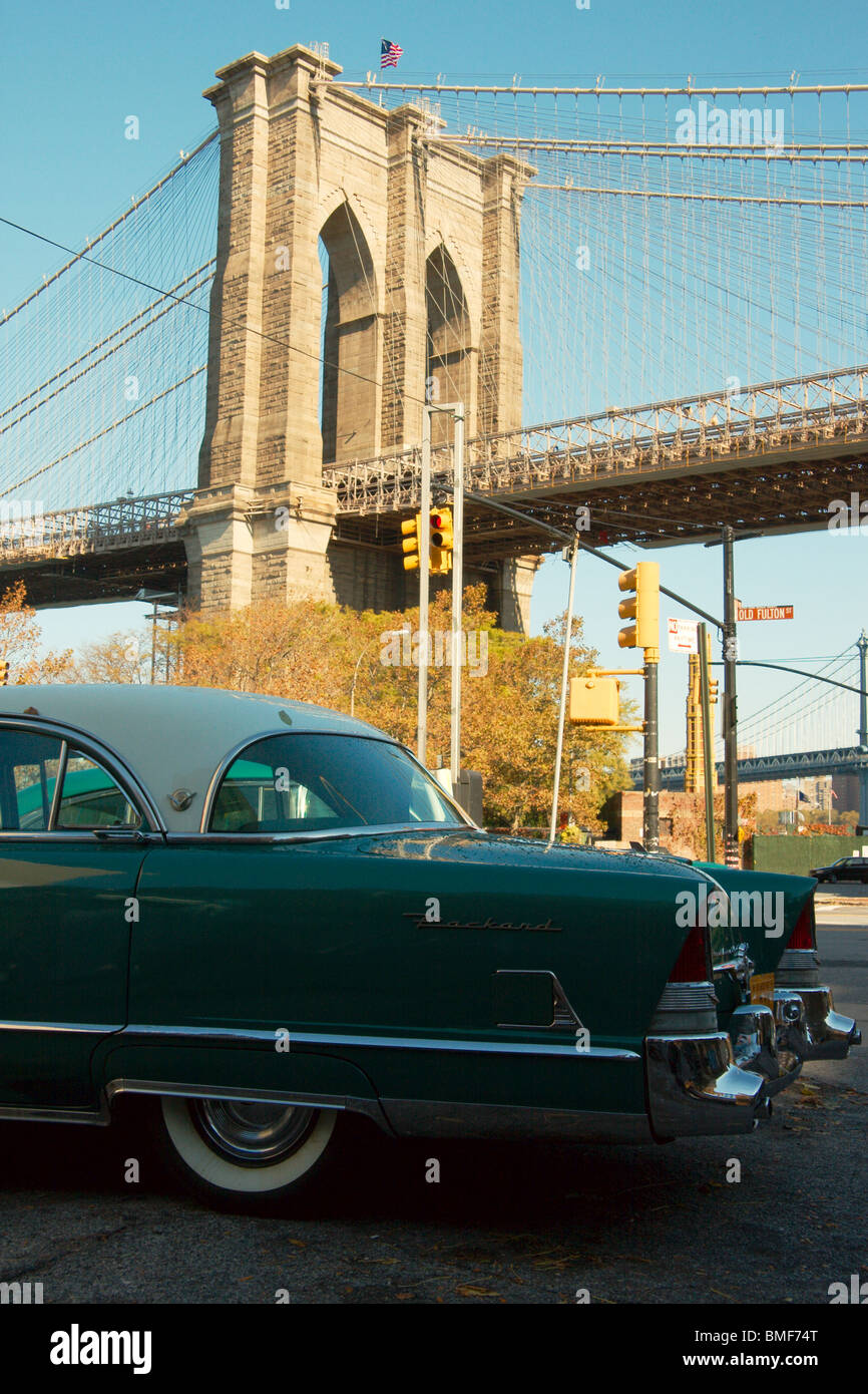 Old 1950s Packard car in front of the Brooklyn Bridge, New York, USA Stock Photo