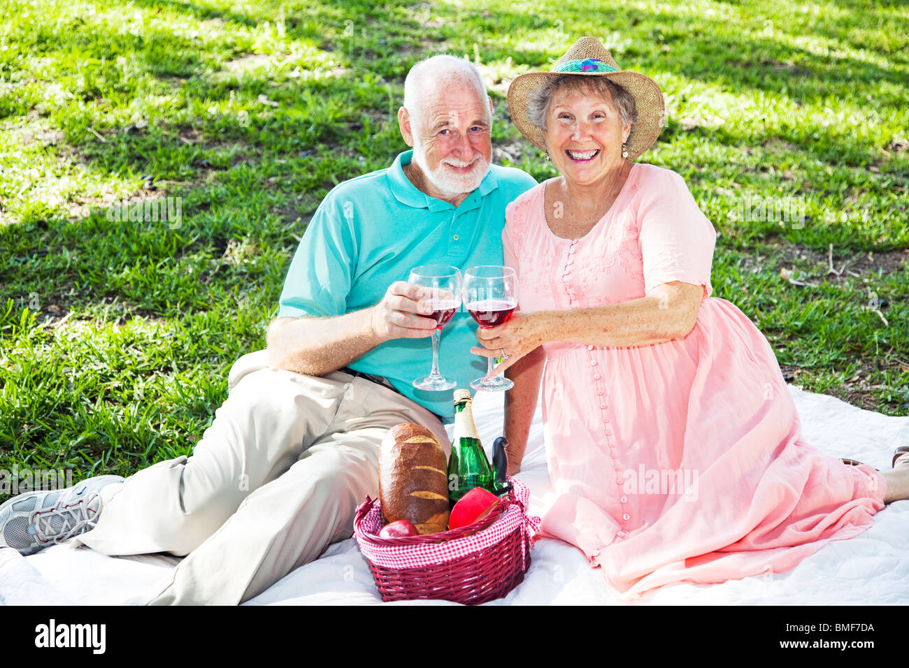 Beautiful senior couple has a romatic picnic in the park Stock Photo ...