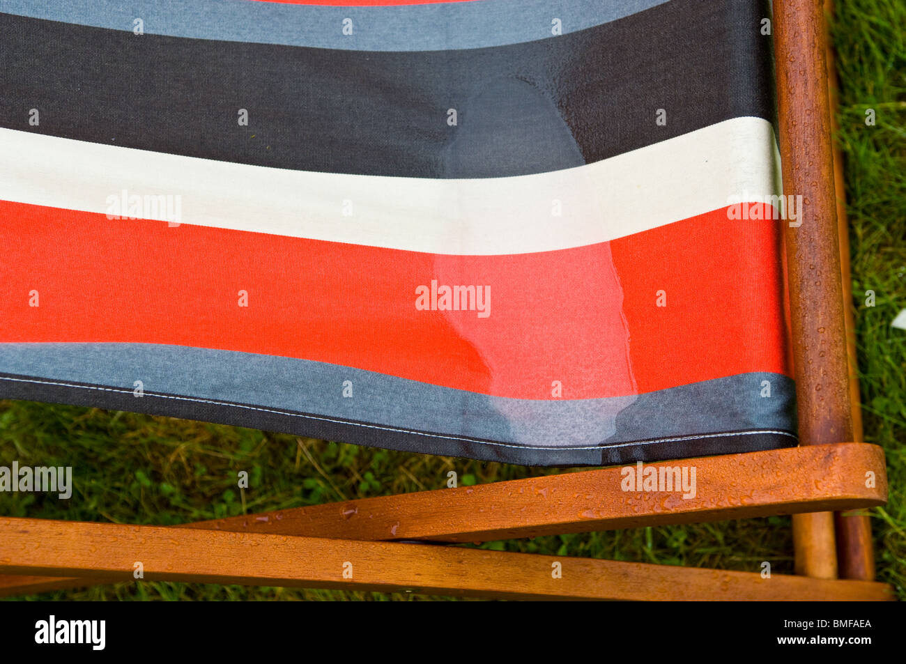 Colourful stripped deckchairs left out in the rain Stock Photo Alamy
