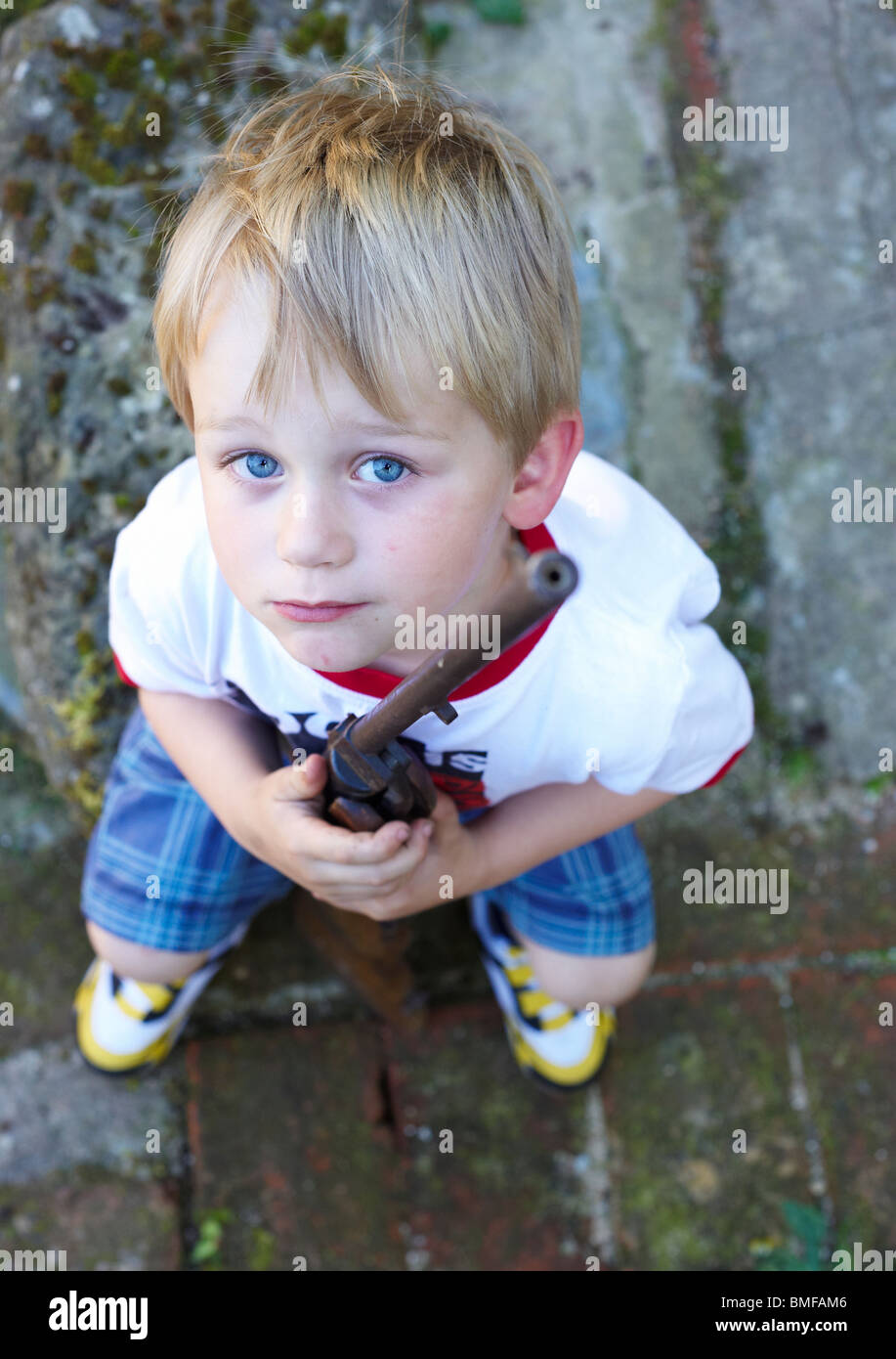 Child blond boy playing with air gun Stock Photo Alamy
