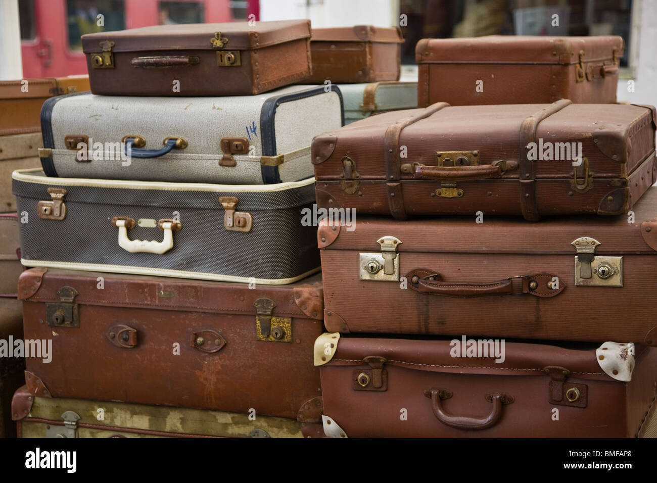 Old fashioned travel suitcases on a trolley Stock Photo Alamy