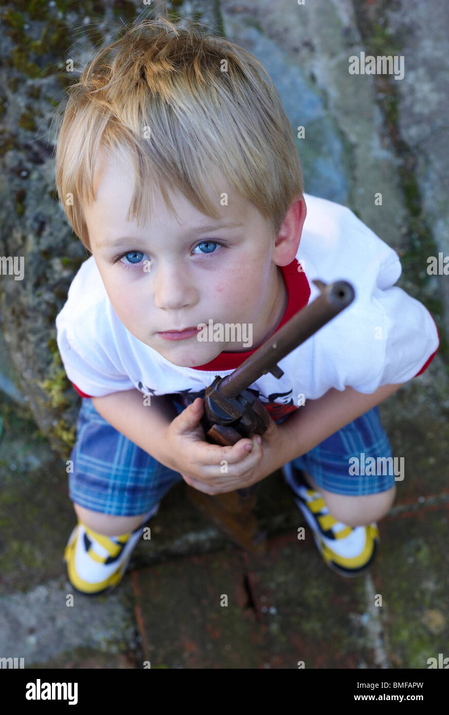 Child blond boy playing with air gun Stock Photo Alamy