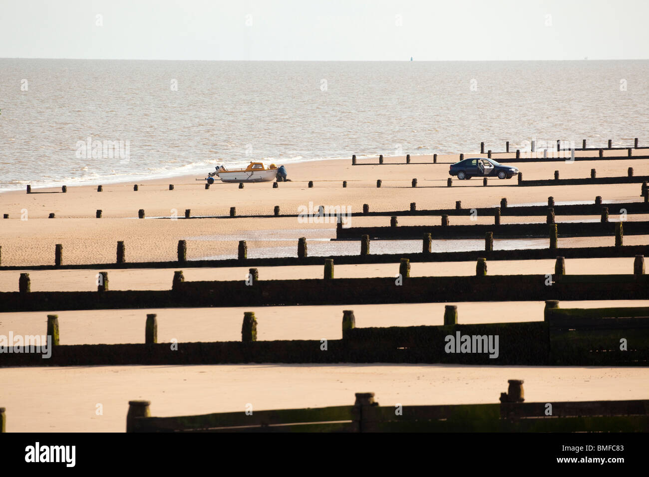 beach at Frinton on Sea Essex UK showing the breakwater groynes Stock Photo