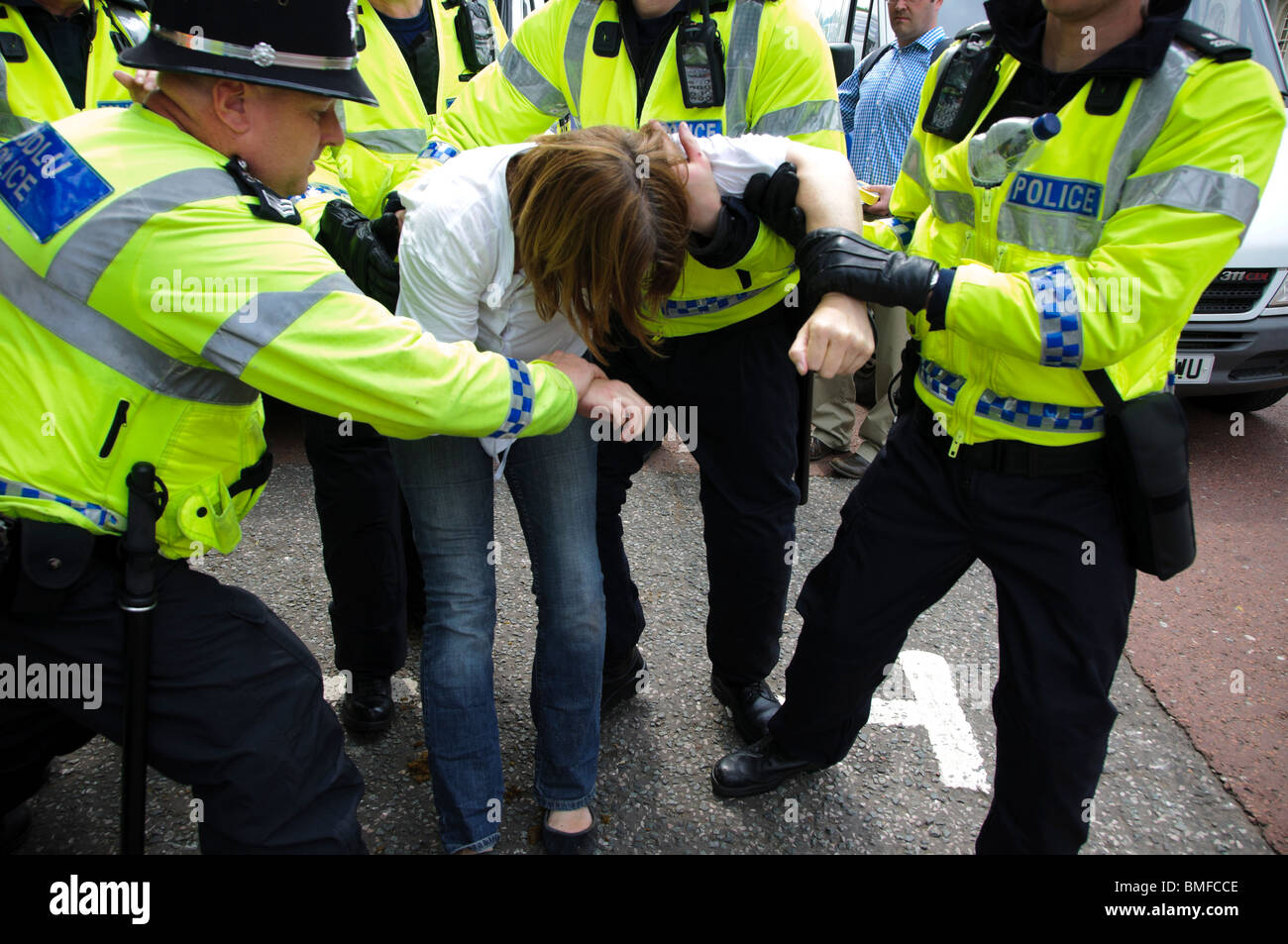 Police arrest a protester from Unite Against Fascism  at City Hall, Cardiff, Wales Stock Photo