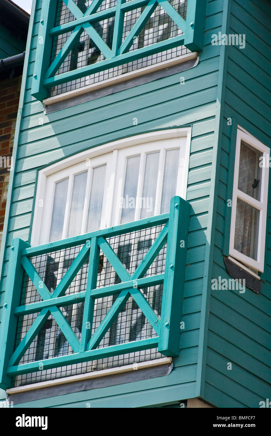 Green Wooden Fascia Boards And Balconies On Apartments Stock Photo
