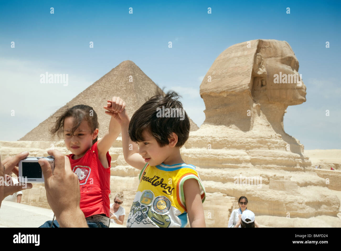 Children Egypt; Two children having their photo taken in front of the