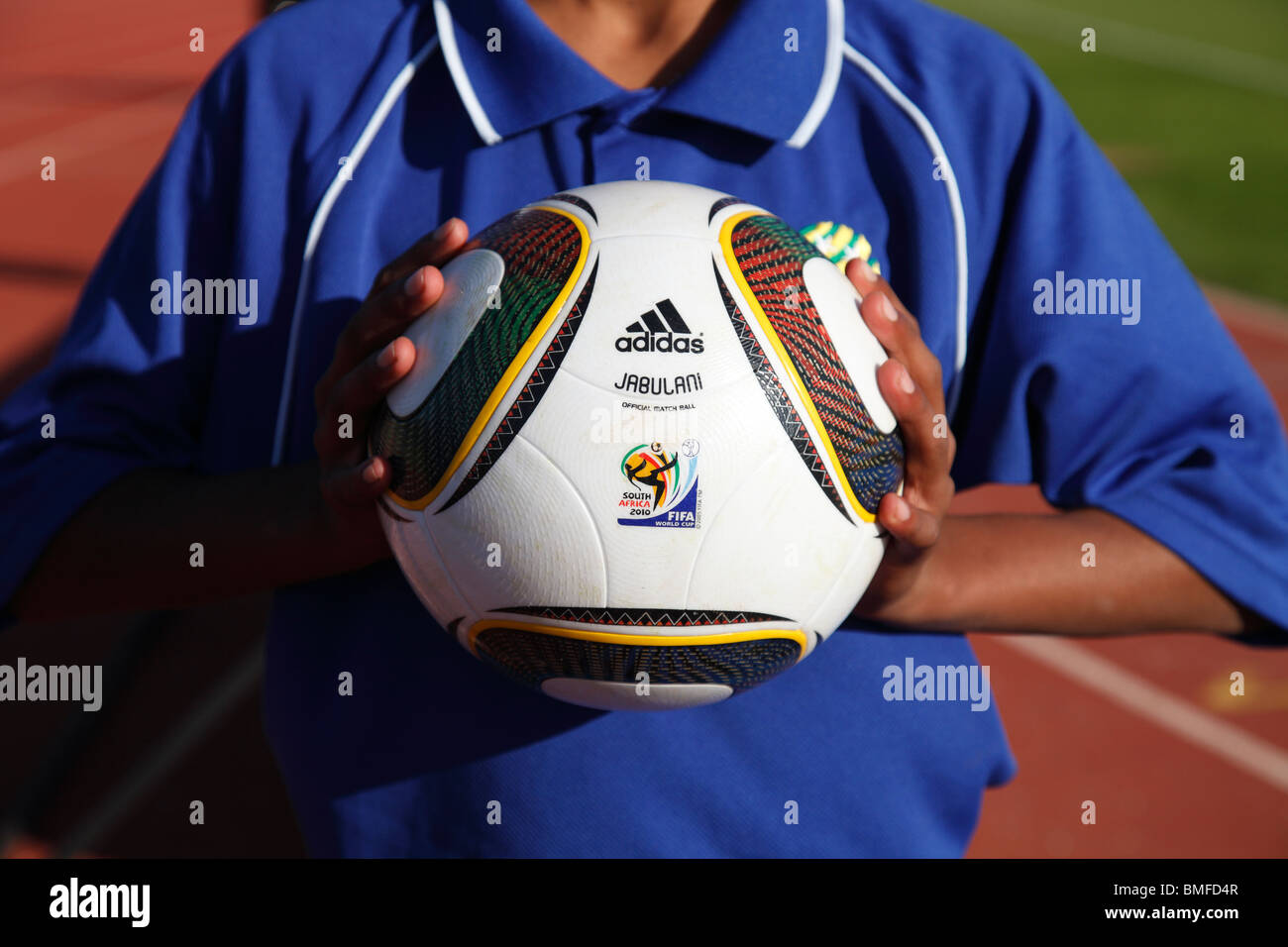 A ball boy holds the official World Cup soccer ball 'Jabulani' at an international friendly match between the USA and Australia. Stock Photo
