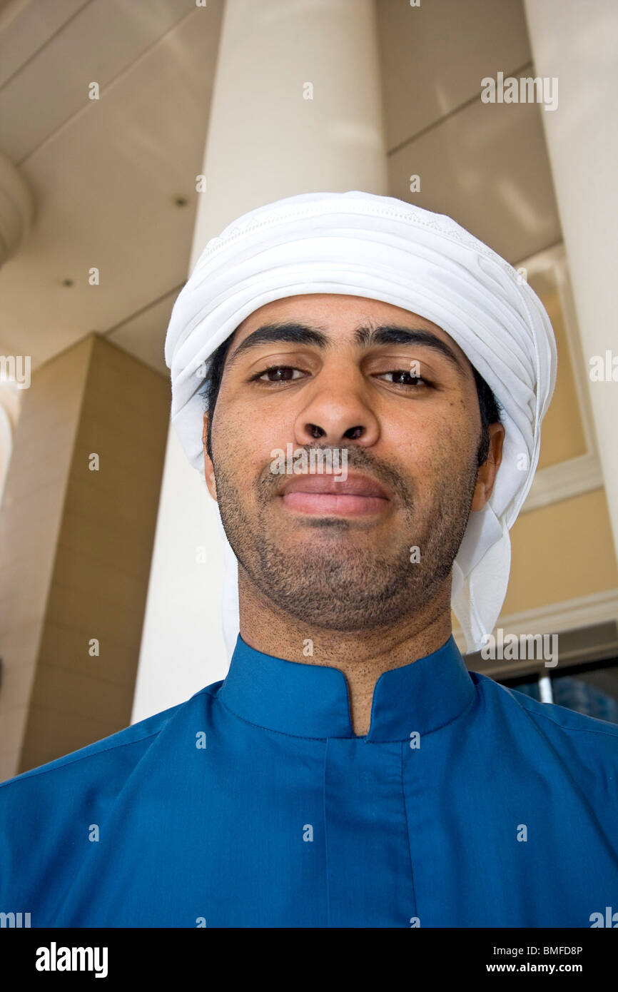 Local Arab man in typical clothing and headdress. Dubai, UAE Stock
