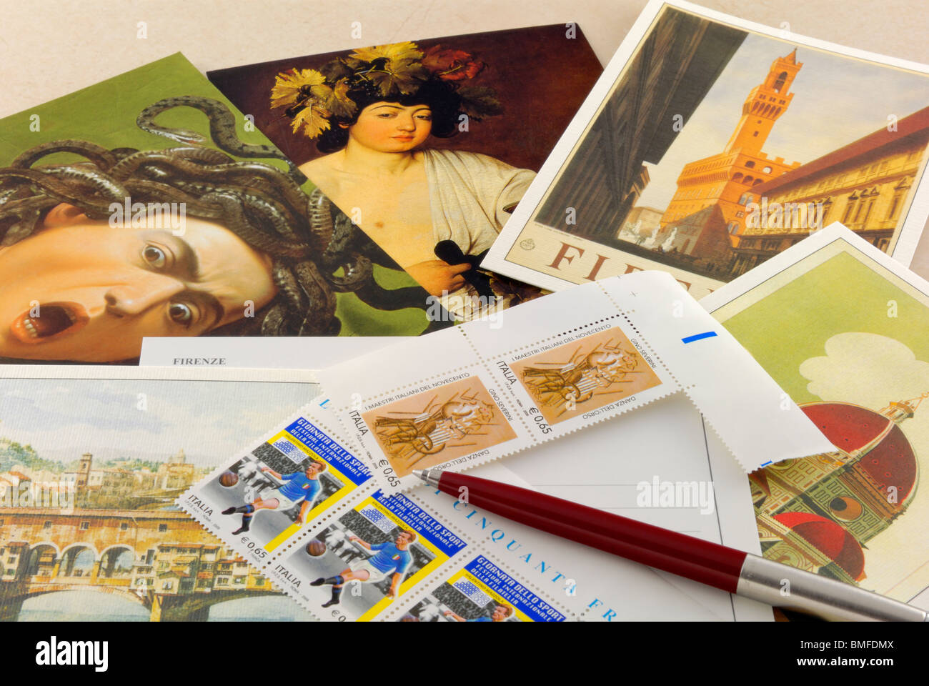 Selecting and writing holiday postcards from Florence, Tuscany, Italy, Europe. Stock Photo